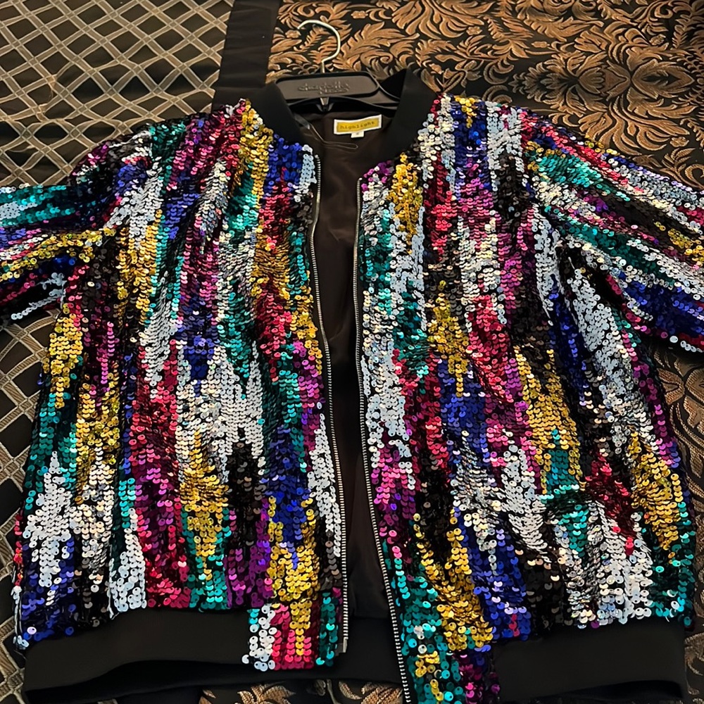 Multi color thin jacket. Very cute. Never has been wore